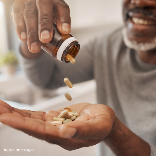 Hand holding supplements.