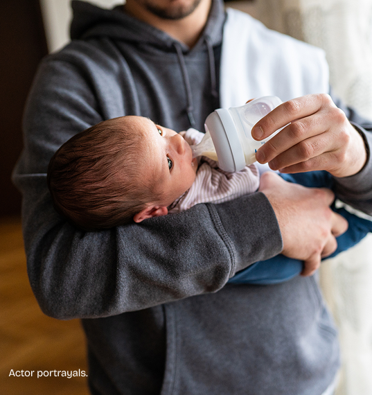 Man feeding baby.